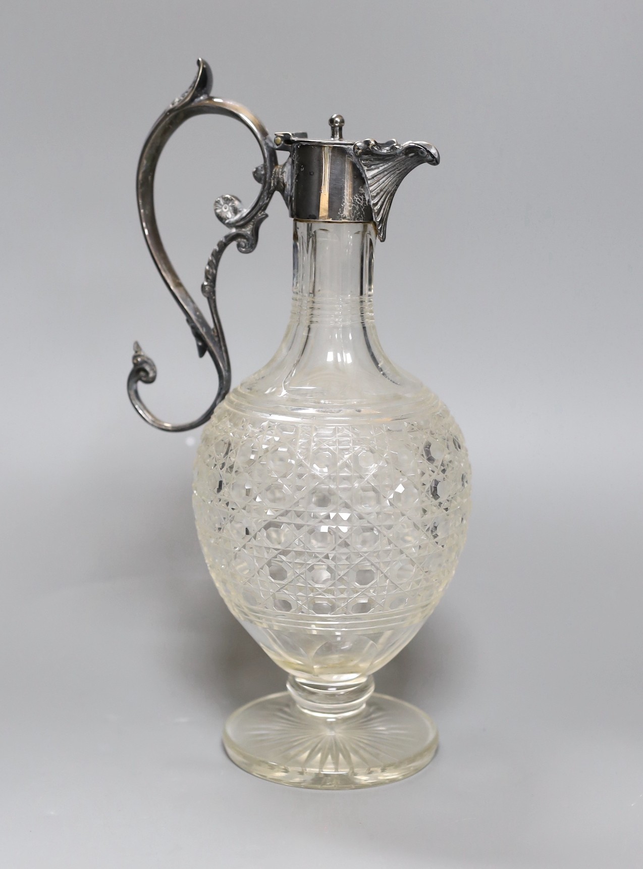 An electroplate mounted cut glass claret jug, 29 cms high